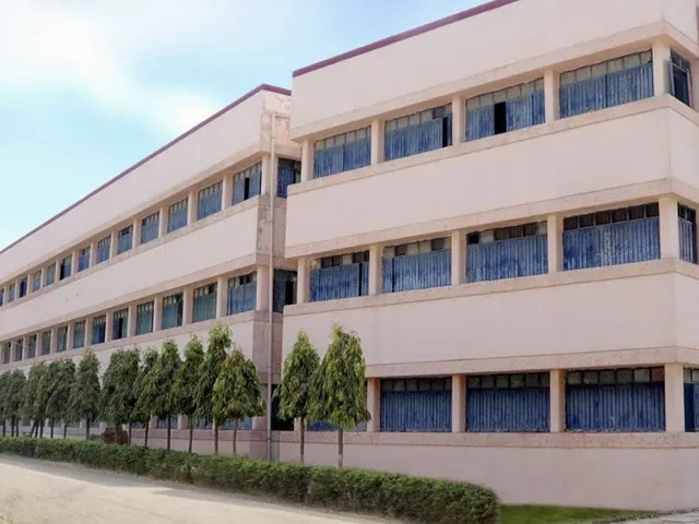 College of Education, a long white building with blue-framed windows